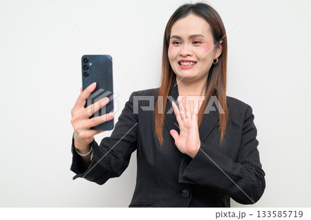 Professional Asian Business Woman Studio Portrait on White Background Using Phone Taking Selfie 133585719