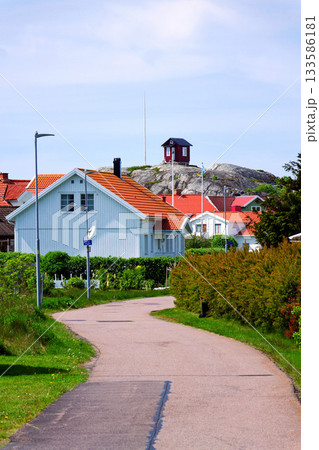 Traditional wooden houses near marina on peaceful car-free Vrango island with seaside village in Gothenburg archipelago, Sweden Traditional wooden houses near marina on peaceful car-free Vrango island with seaside village in Gothenburg archipelago, Sweden 133586181