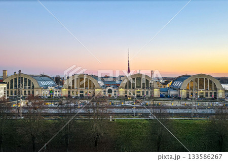 Historic Riga market pavilions at sunset, built using World War I German airship hangar structures Historic Riga market pavilions at sunset, built using World War I German airship hangar structures 133586267
