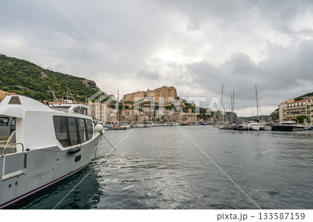 Aerial view marina cape Bonifacio south Corsica France citadel on rocky promontory on wild white limestone cliffs Aerial view marina cape Bonifacio south Corsica France citadel on rocky promontory on wild white limestone cliffs 133587159