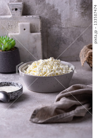 Cottage cheese on light background 133587474