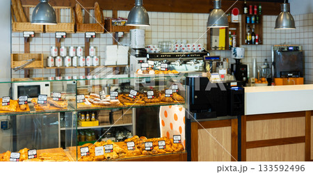 Warm bakery scene with fresh bread and pastries 133592496