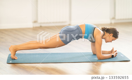 Different yoga poses performed by a slender girl in gym Different yoga poses performed by a slender girl in gym 133592655