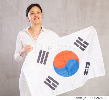 Young woman posing in studio with South Korea flag 133592895