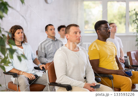 Man student listening to lecture with male coursemates 133593226
