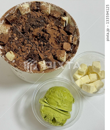 Rich and indulgent chocolate bingsu topped with chocolate syrup, brownie chunks, and chocolate shavings. A heavenly treat for chocoholics seeking a cool and creamy dessert escape. Rich and indulgent chocolate bingsu topped with chocolate syrup, brownie chunks, and chocolate shavings. A heavenly treat for chocoholics seeking a cool and creamy dessert escape. 133594125