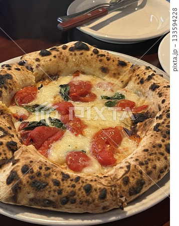 A delicious pizza with a golden crust, melted cheese, and savory toppings. Perfect for food-related designs, menus, or Italian-themed projects, capturing the essence of a classic comfort dish. A delicious pizza with a golden crust, melted cheese, and savory toppings. Perfect for food-related designs, menus, or Italian-themed projects, capturing the essence of a classic comfort dish. 133594228