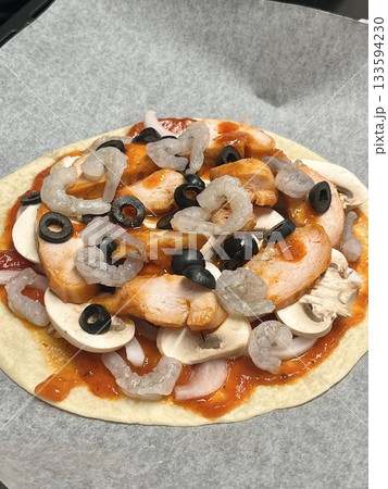 A delicious pizza with a golden crust, melted cheese, and savory toppings. Perfect for food-related designs, menus, or Italian-themed projects, capturing the essence of a classic comfort dish. A delicious pizza with a golden crust, melted cheese, and savory toppings. Perfect for food-related designs, menus, or Italian-themed projects, capturing the essence of a classic comfort dish. 133594230