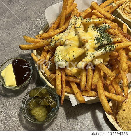 Crispy, golden French fries with a perfect balance of crunch and softness. Lightly salted and ideal as a snack or side dish, they pair well with ketchup, mayo, or your favorite dipping sauce. 133594388