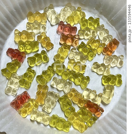 Bright and colorful gummy bears with a chewy texture and fruity flavors. These fun and playful treats are perfect for snacking, sharing, or adding a splash of sweetness to any occasion. Bright and colorful gummy bears with a chewy texture and fruity flavors. These fun and playful treats are perfect for snacking, sharing, or adding a splash of sweetness to any occasion. 133594446