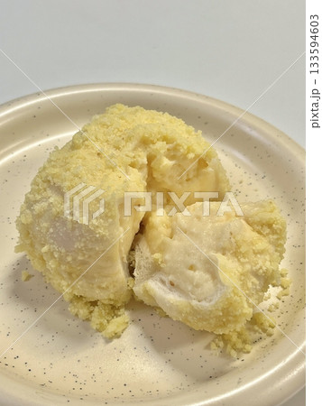 Soft and fluffy cream bread (크림빵) filled with sweet, silky cream, offering a perfect bite of pillowy texture and rich, creamy indulgence in every delightful mouthful. 133594603