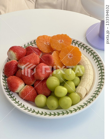 Colorful fruit platters filled with fresh, juicy slices of melon, berries, kiwi, and citrus—offering a perfect mix of vibrant colors, natural sweetness, and refreshing flavor in every bite. 133594632