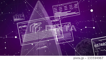 Viewing IT professional analyzing holographic data panels in cyber network, with numeric readouts 133594967