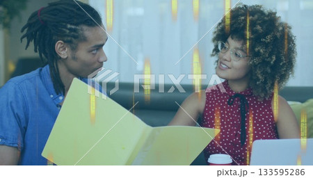 Reviewing document man and woman colleagues consulting in modern office lounge, with yellow folder Reviewing document man and woman colleagues consulting in modern office lounge, with yellow folder 133595286