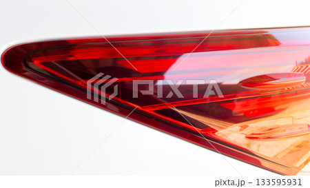 Close up of traillgith of white car. Bright and luxurious lamp cover. 133595931