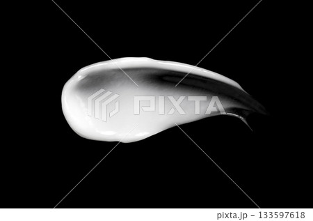 A sample of white body cosmetics on a black background 133597618
