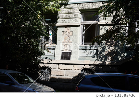 Photovoltaic solar panel in front of historical building. Concept of integration of sustainable renewable energy sources into old architecture. Photovoltaic solar panel in front of historical building. Concept of integration of sustainable renewable energy sources into old architecture. 133598436