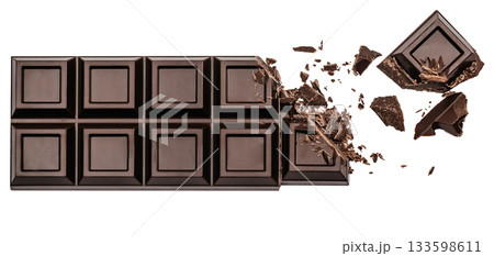 Broken dark chocolate bar with scattered chunks on white background Broken dark chocolate bar with scattered chunks on white background 133598611