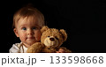 little girl with a teddy bear 133598668