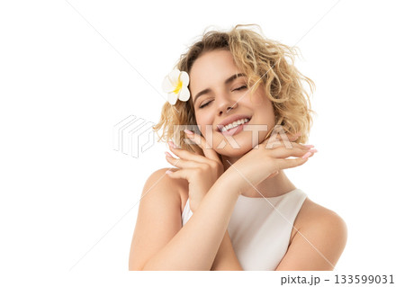 Curly-haired woman smiles, caring for skin, isolated on white, PNG 133599031
