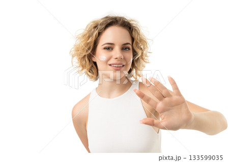 Woman uses facial care on clean skin, isolated on white, PNG 133599035