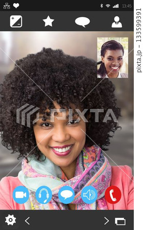 Flat phone interface showing smiling woman in pink coat and scarf with inset friend, control icons 133599391