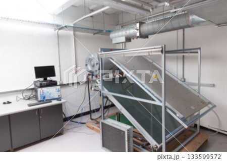 Large wheeled test apparatus is standing in flat design lab, with angled panel and network cables Large wheeled test apparatus is standing in flat design lab, with angled panel and network cables 133599572