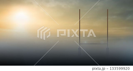 Flat vector illustration showing rugby goalposts emerging from misty sports field at dawn 133599920