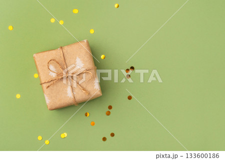 A Christmas gift wrapped in eco-friendly packaging 133600186