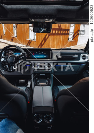 Luxury vehicle interior showcases modern design and technology on a sunny day 133600622