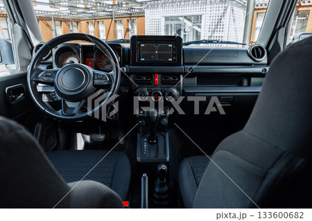 Modern car interior design featuring advanced dashboard and control features 133600682
