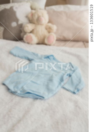 High angle view of clothing by stuffed toy on bed High angle view of clothing by stuffed toy on bed 133601519