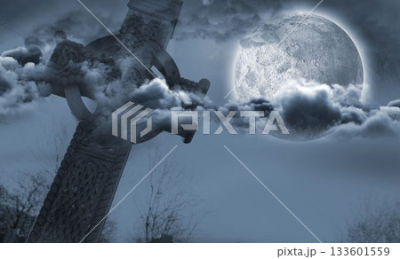 Celtic cross in front of moon behind clouds Celtic cross in front of moon behind clouds 133601559