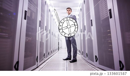 Flat design showing suited man guarding servers in data center aisle with shield and sword overlays 133601587