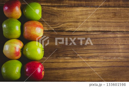 Red and green apples on table 133601598