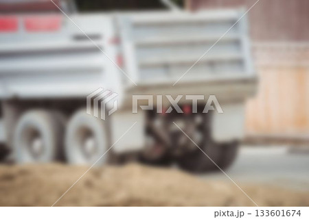 Defocused image of dumper truck on road Defocused image of dumper truck on road 133601674