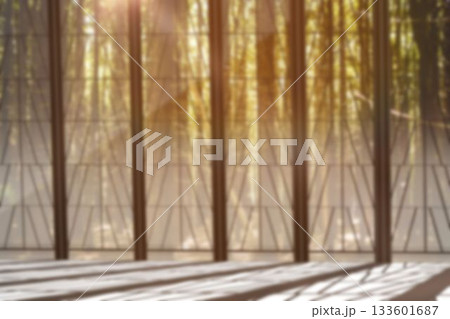 Metal bars holding glass wall against woods Metal bars holding glass wall against woods 133601687