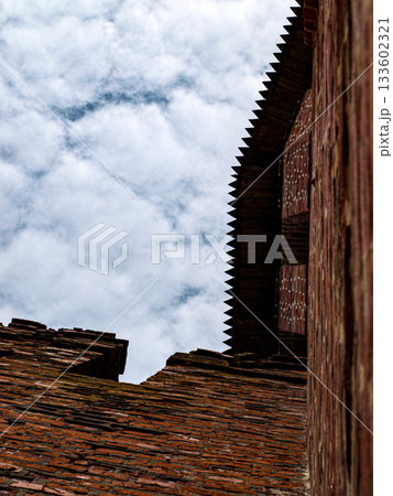 A tower with a roof and amazing brickwork in an unusual shooting angle 133602321