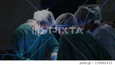 Performing procedure, surgeons wearing scrubs around table with instruments in OR, with DNA overlay 133602413
