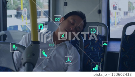 Sleeping commuter wearing white shirt on bus seat near handrail and window, green icons floating 133602438