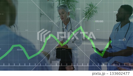 Consulting team with senior physician in coat in clinic with stethoscopes, digital graph overlay 133602477