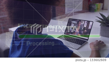 Working clinician in blue scrubs typing on laptop at desk, with encrypted data overlay, copy space Working clinician in blue scrubs typing on laptop at desk, with encrypted data overlay, copy space 133602609