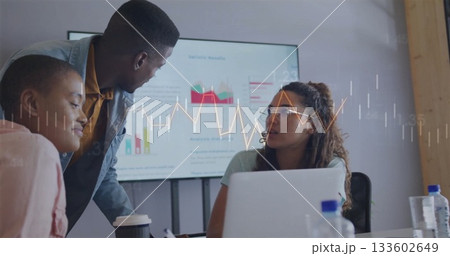 Three colleagues wearing business attire discussing data in meeting room, with laptop, screen Three colleagues wearing business attire discussing data in meeting room, with laptop, screen 133602649
