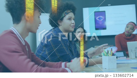 Gesturing woman wearing blue plaid shirt leading discussion in conference room, with display screen Gesturing woman wearing blue plaid shirt leading discussion in conference room, with display screen 133602714