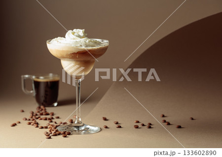 Black coffee and iced coffee cocktail on a beige background. 133602890