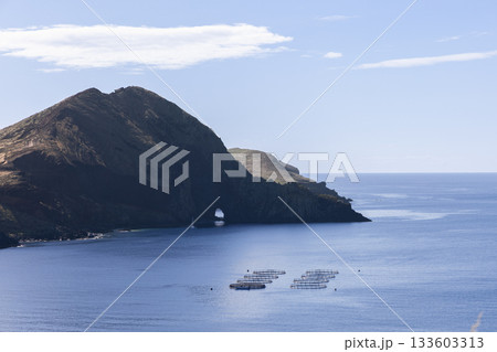 Sea arch and mussel structures near rugged cliffs of Ponta de Sao Lourenco Madeira Sea arch and mussel structures near rugged cliffs of Ponta de Sao Lourenco Madeira 133603313