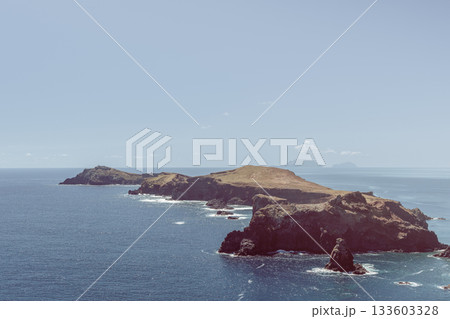 Muted earthy cliffs and headland at Ponta de Sao Lourenco Madeira with calm ocean view Muted earthy cliffs and headland at Ponta de Sao Lourenco Madeira with calm ocean view 133603328