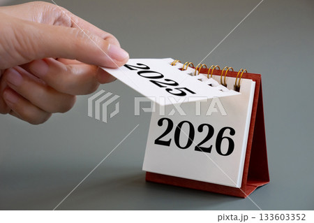 hand flipping calendar page turning from 2025 to 2026, New Year calendar concept. desk calendar flip page for new year celebration 133603352