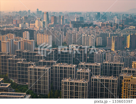 Many residential apartment buildings fill the skyline of an urban city in China during the daytime 133603397