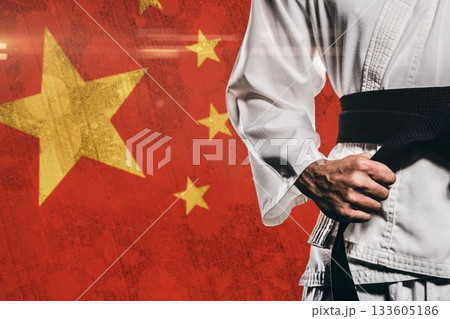 Midsection of martial artist against Chinese Flag Midsection of martial artist against Chinese Flag 133605186